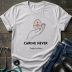 Caring Never Stops Nurse Humor Graphic Tee - Sport Grey / XS | YOUSTOMIZE