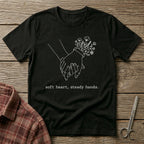 Soft Heart, Steady Hands T-Shirt — Minimalist Hand-Holding Nurse Design-Black / XS-YOUSTOMIZE